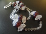 A prayer bead strand with handmade artistan lampwork beads, herkimer diamonds, garnet, and rock quartz.