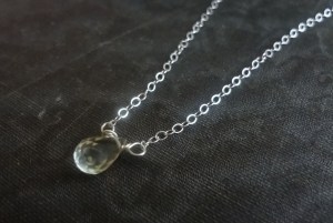 A sterling silver necklace with pale yellow lemon quartz teardrop